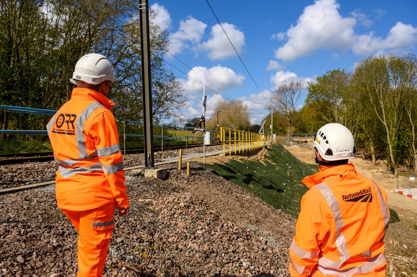 ORR Inspector viewing railway embankment.