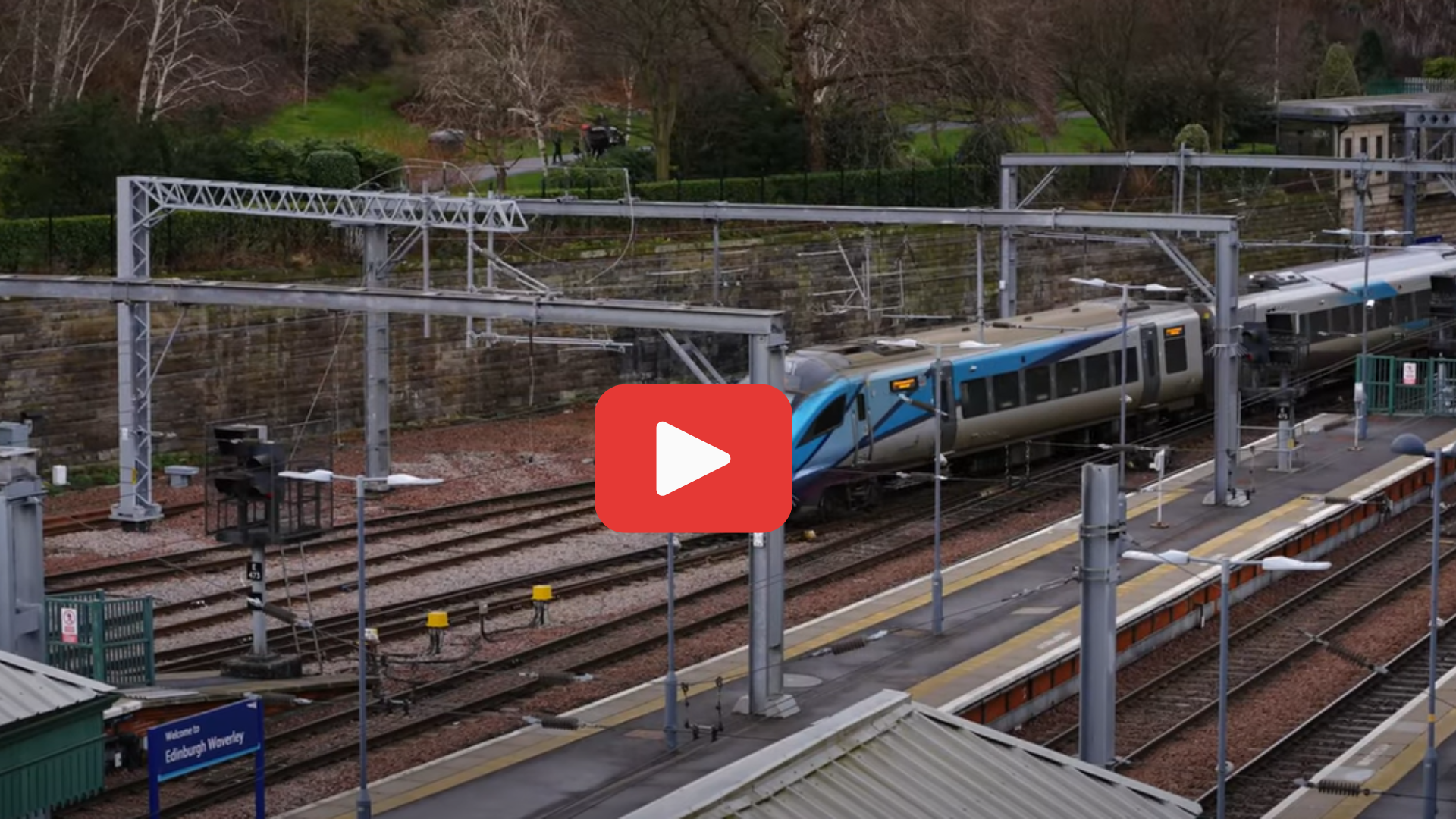 Train at Waverley station. A play button appears over the image indicating a link to YouTube to watch the video