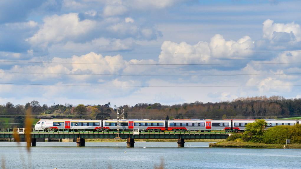 Greater Anglia train crossing a railway bridge