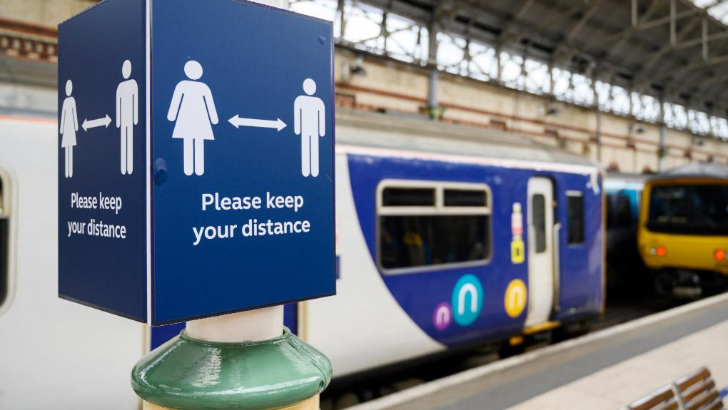 Covid-19 social distancing sign at Manchester Piccadilly station