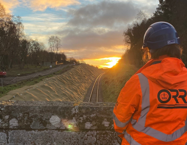 Civil Engineer looking at a sunset on a site visit